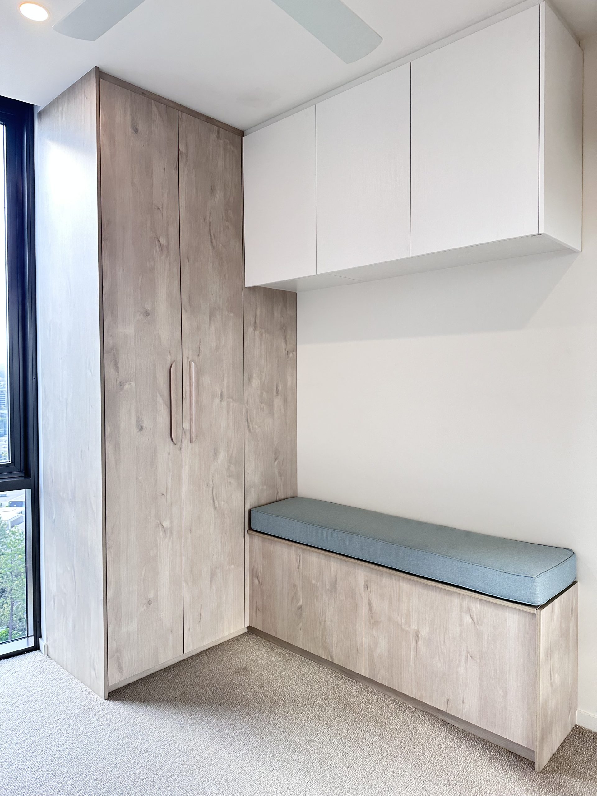 West End 04 A wardrobe with a small seating area next to it