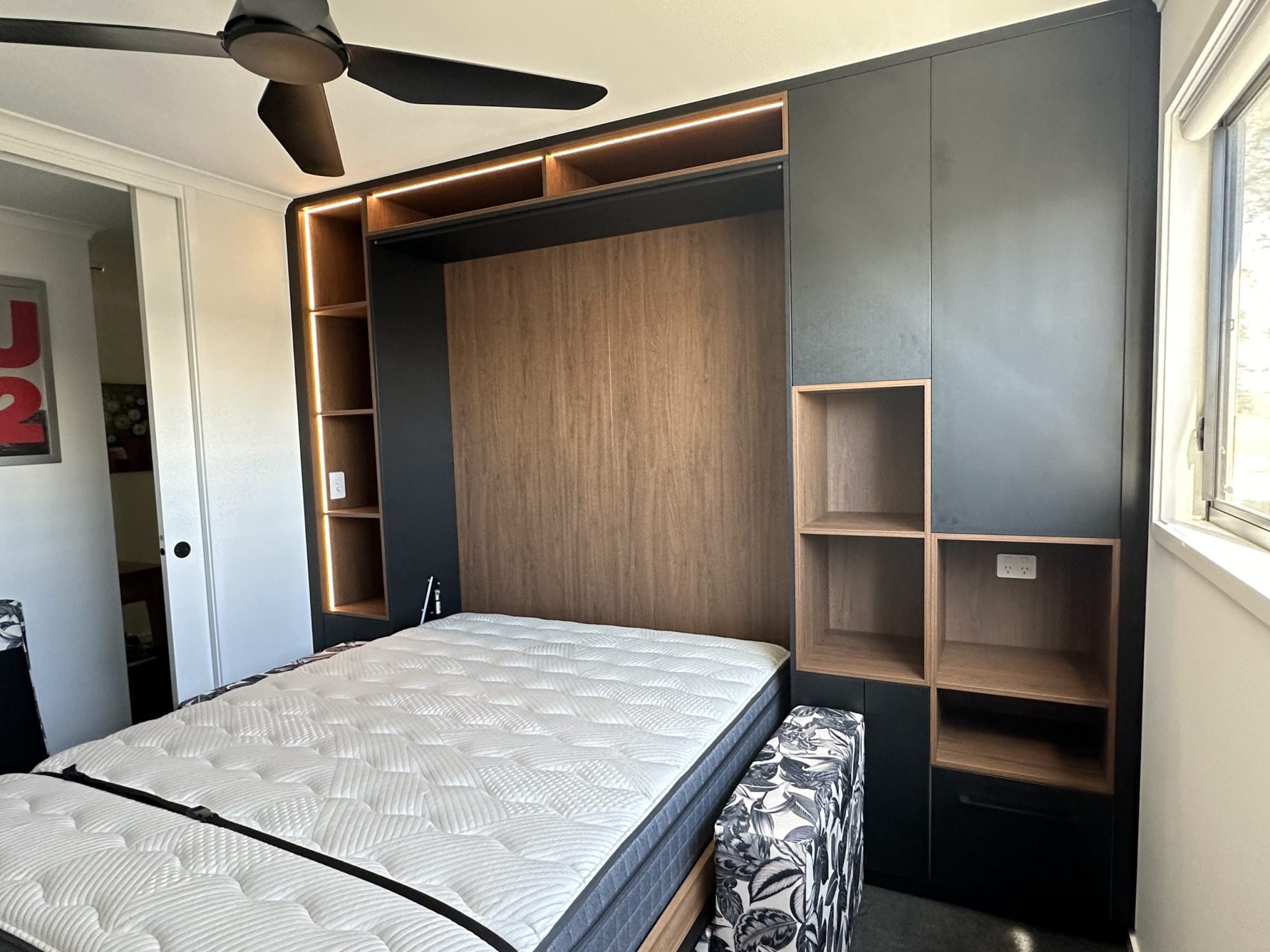 Newly renovated small space with a wall bed